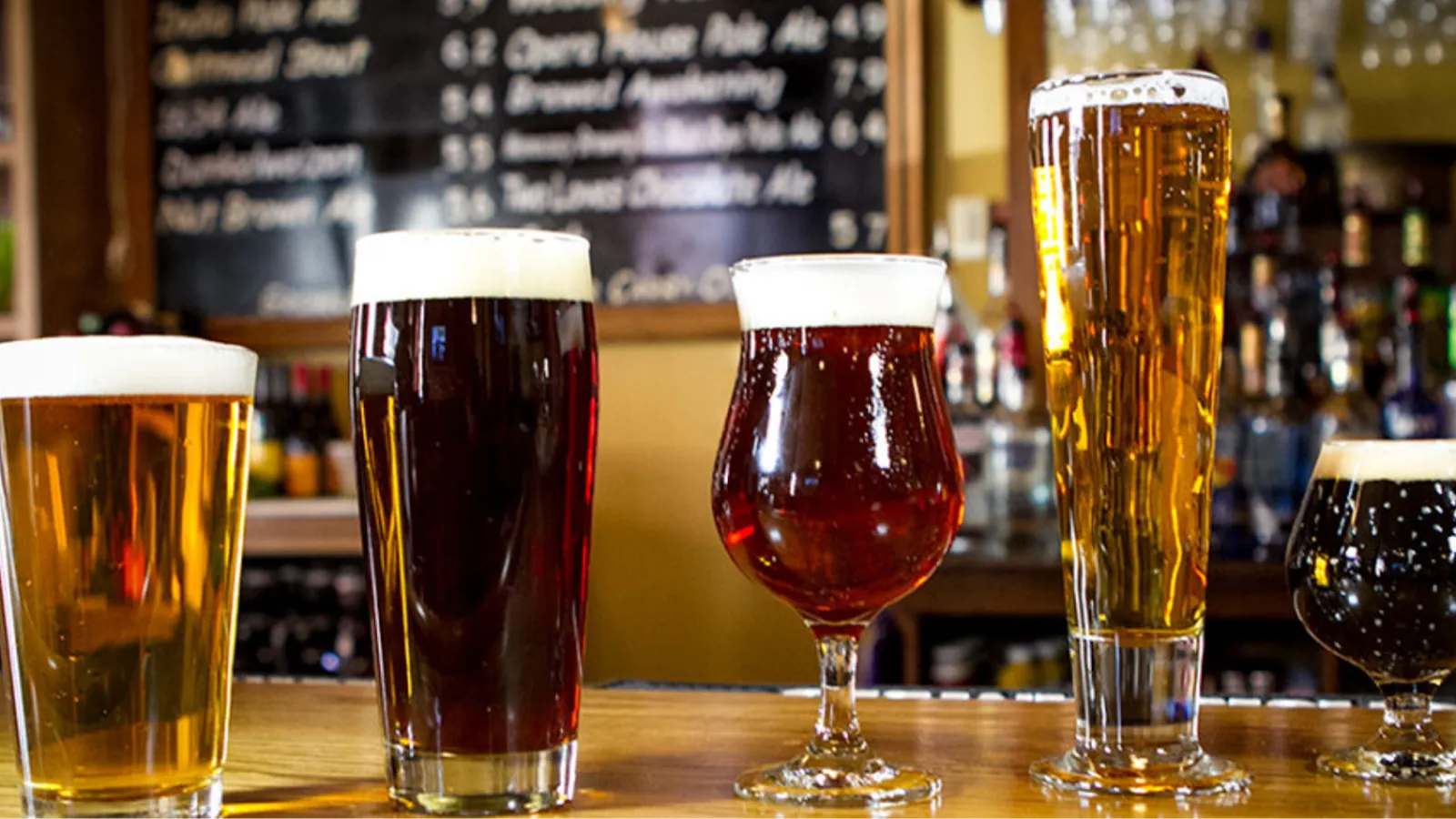 Four pints lined up on the bar at Brewer's Alley in Frederick